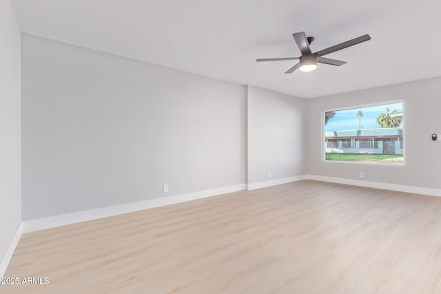 unfurnished room featuring ceiling fan and light hardwood / wood-style flooring