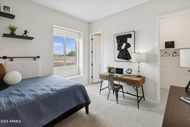 bedroom featuring light colored carpet