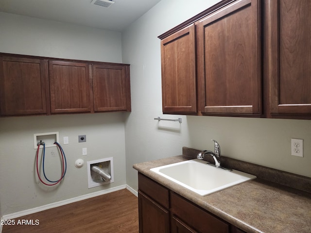 washroom featuring sink, cabinets, hookup for a washing machine, hookup for an electric dryer, and hookup for a gas dryer