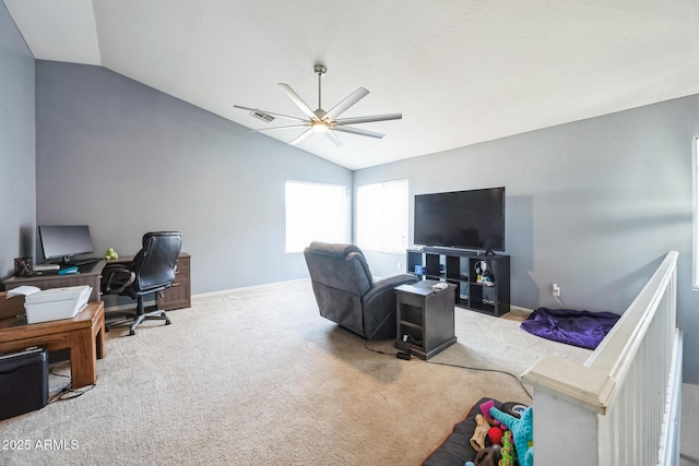 home office featuring carpet, lofted ceiling, and ceiling fan