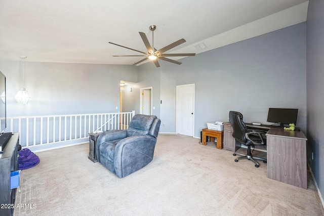 office featuring lofted ceiling and light colored carpet