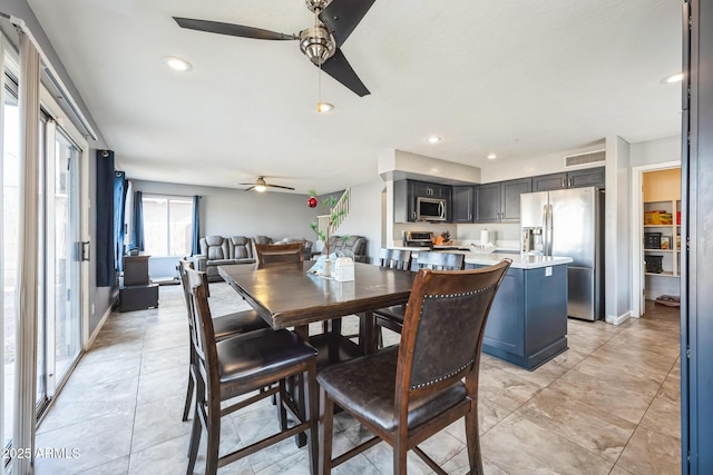 dining space featuring ceiling fan