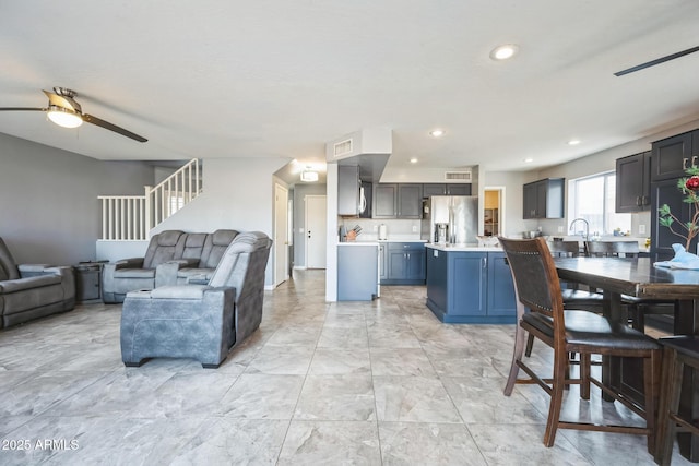 living room with ceiling fan