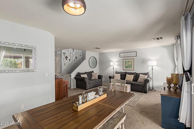 living room with light carpet and visible vents