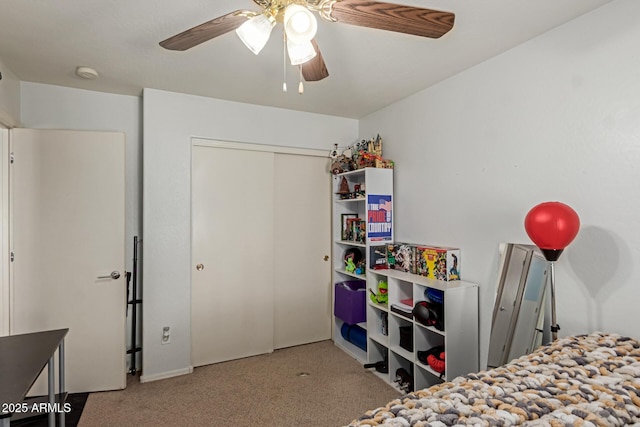 bedroom featuring a closet, a ceiling fan, and carpet floors
