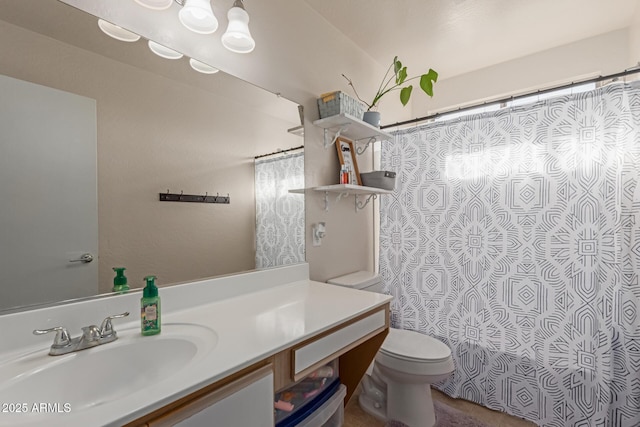 bathroom featuring toilet, curtained shower, and vanity