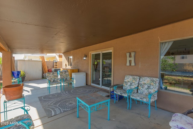 view of patio / terrace featuring fence