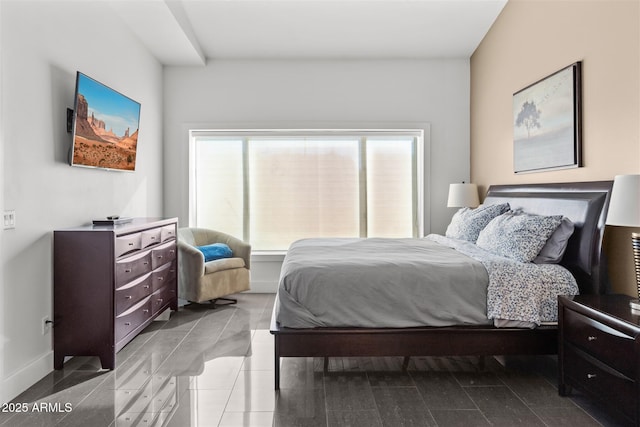 bedroom featuring baseboards