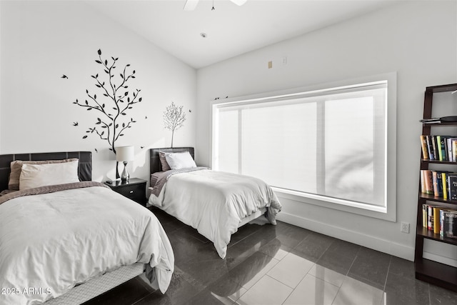 bedroom featuring vaulted ceiling, baseboards, tile patterned floors, and a ceiling fan
