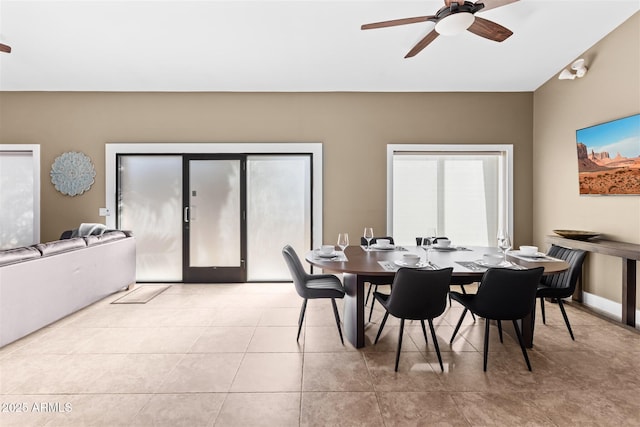 dining room with ceiling fan and light tile patterned flooring