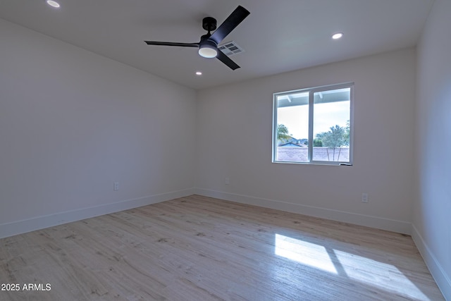 unfurnished room featuring ceiling fan and light hardwood / wood-style flooring