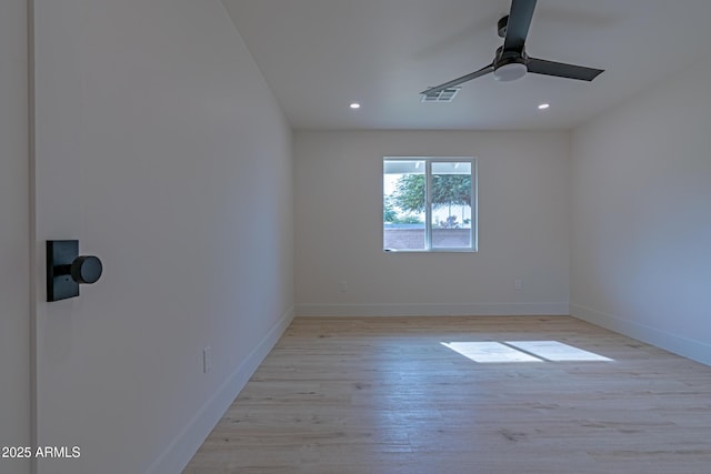 unfurnished room with ceiling fan and light hardwood / wood-style flooring