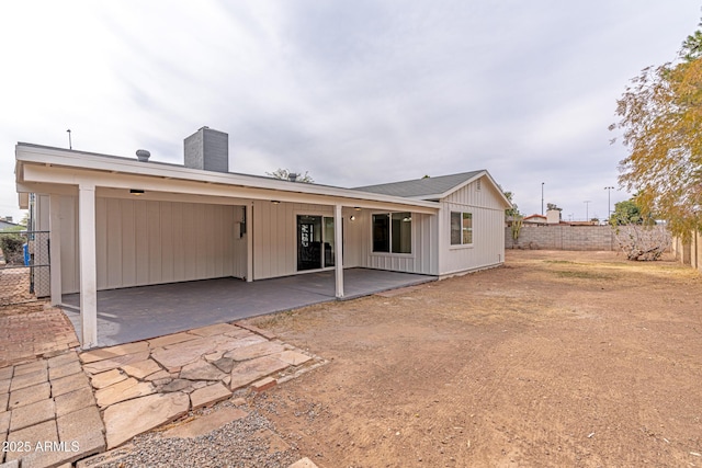 rear view of property featuring a patio