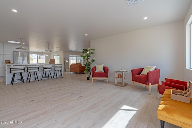 sitting room with light wood-type flooring