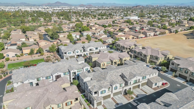 birds eye view of property featuring a mountain view