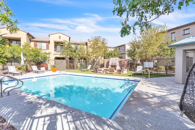 view of swimming pool featuring a patio area