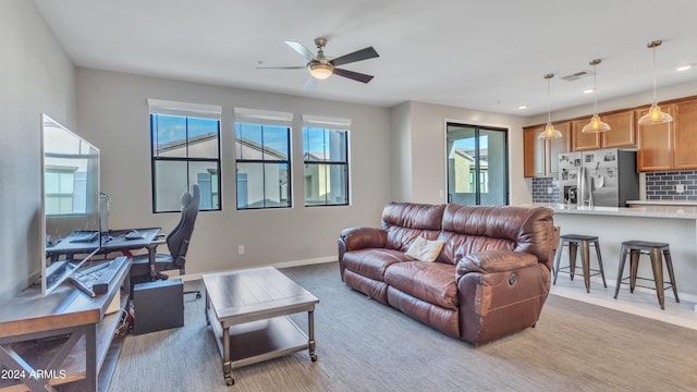 living room with ceiling fan