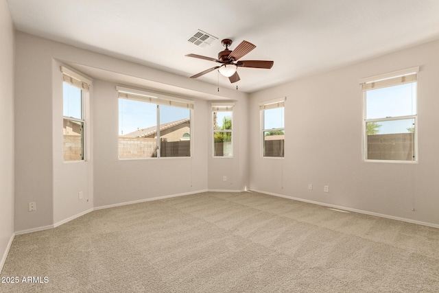 17493 N Costa Brava Ave, Maricopa, AZ 85139 - carpeted empty room featuring plenty of natural light and ceiling fan