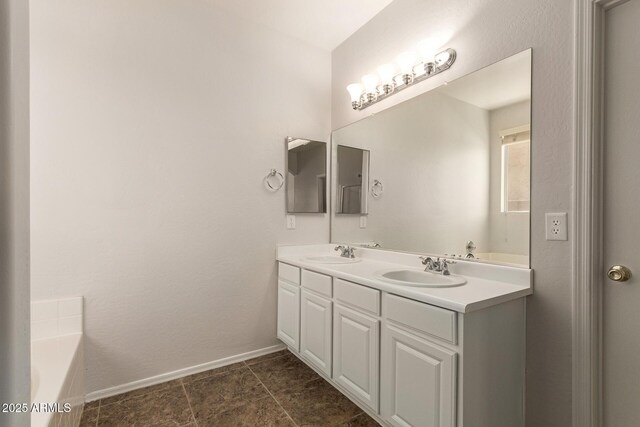 17493 N Costa Brava Ave, Maricopa, AZ 85139 - bathroom featuring double vanity and a garden tub