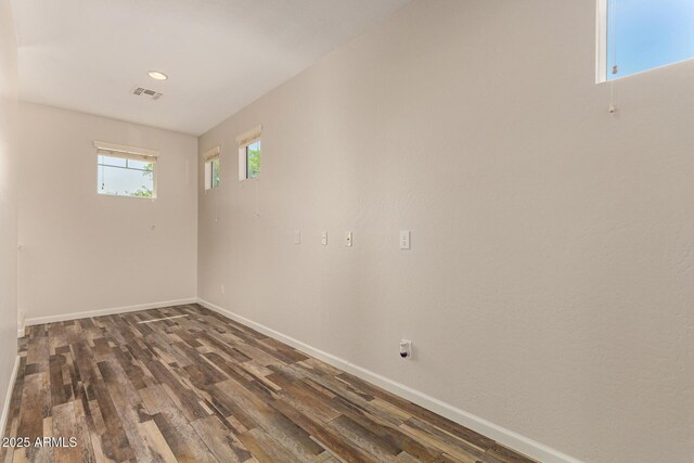 17493 N Costa Brava Ave, Maricopa, AZ 85139 - empty room featuring dark wood-style floors and recessed lighting