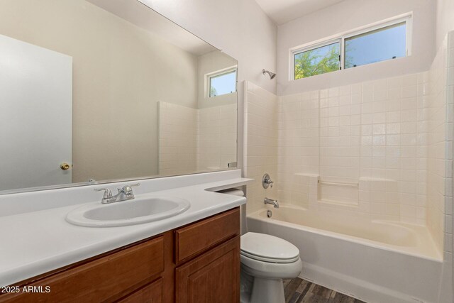 17493 N Costa Brava Ave, Maricopa, AZ 85139 - full bathroom with vanity, wood finished floors, and washtub / shower combination