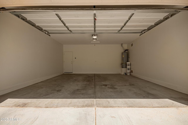 17493 N Costa Brava Ave, Maricopa, AZ 85139 - garage with a garage door opener and water heater