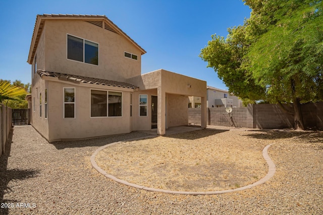 17493 N Costa Brava Ave, Maricopa, AZ 85139 - rear view of property with stucco siding, a fenced backyard, a tile roof, and a patio area