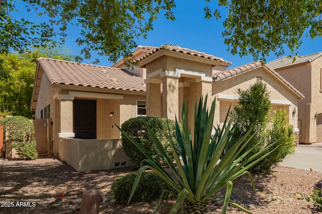 17493 N Costa Brava Ave, Maricopa, AZ 85139 - view of front of house featuring stucco siding, a tiled roof, and driveway