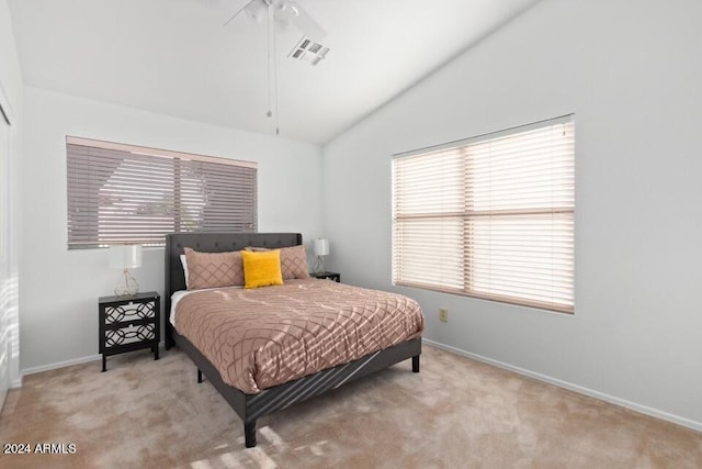 carpeted bedroom featuring ceiling fan and lofted ceiling