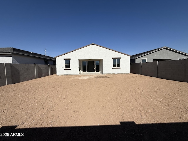 back of property with a patio area