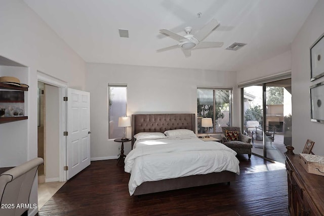 bedroom with wood finished floors, visible vents, baseboards, vaulted ceiling, and access to outside