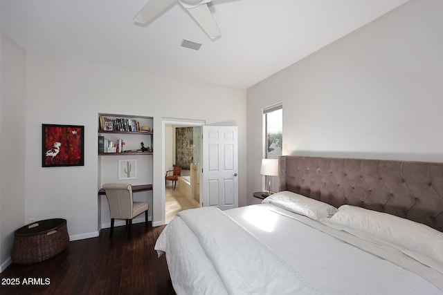 bedroom featuring a ceiling fan, visible vents, dark wood finished floors, and baseboards