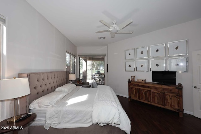 bedroom with ceiling fan, wood finished floors, visible vents, and baseboards