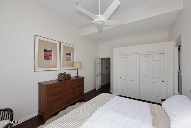 bedroom with a ceiling fan, a closet, baseboards, and wood finished floors