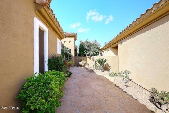 view of patio / terrace featuring fence