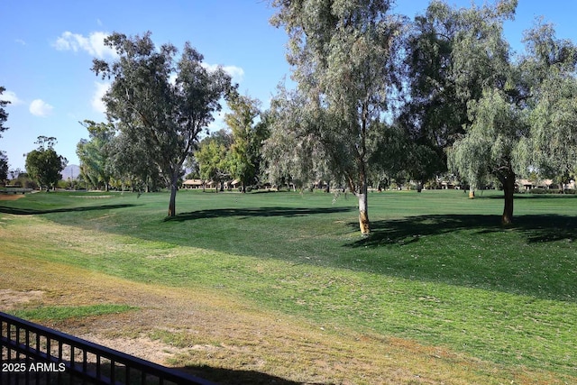 view of property's community with a lawn