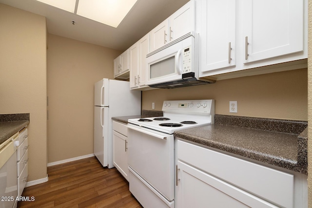 11375 E Sahuaro Dr Unit 1055, Scottsdale, AZ 85259 - kitchen with white appliances, dark countertops, wood finished floors, and white cabinets