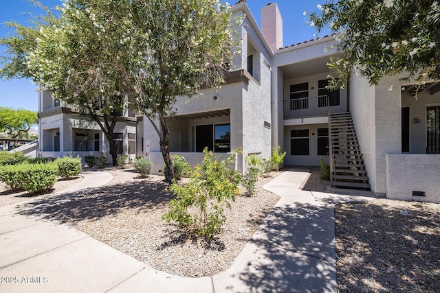 11375 E Sahuaro Dr Unit 1055, Scottsdale, AZ 85259 - view of front of house featuring stairs and stucco siding