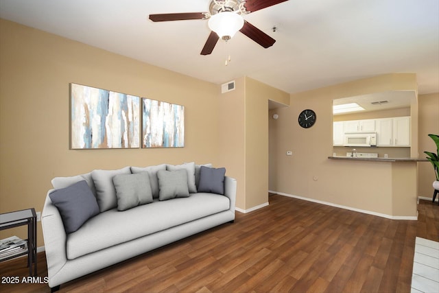 11375 E Sahuaro Dr Unit 1055, Scottsdale, AZ 85259 - living room featuring dark wood-type flooring and a ceiling fan
