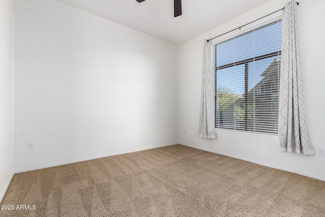 spare room with carpet flooring and ceiling fan