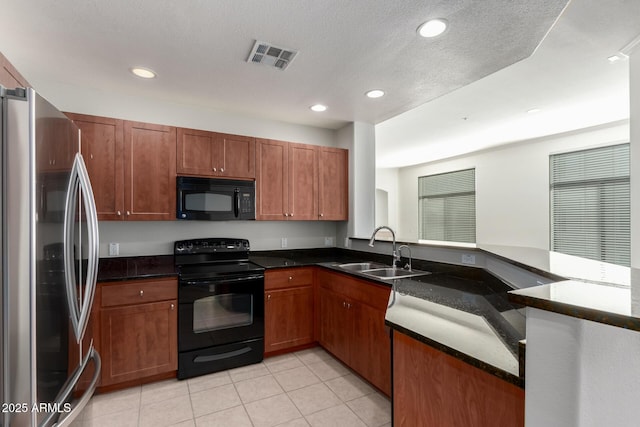 kitchen featuring sink, kitchen peninsula, a textured ceiling, light tile patterned flooring, and black appliances