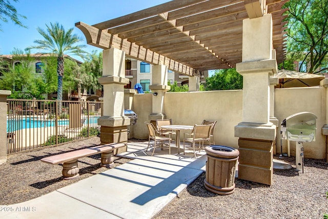 view of patio / terrace featuring a pergola, a community pool, and a grill