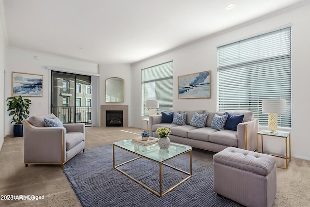 carpeted living room with ornamental molding