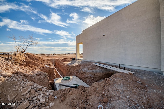 view of side of home featuring stucco siding