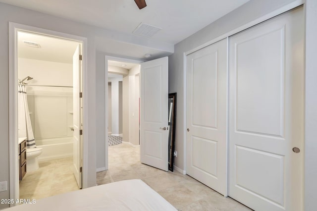 19908 W Montecito Ave, Litchfield Park, AZ 85340 - bedroom with light tile patterned floors, ensuite bathroom, and a closet