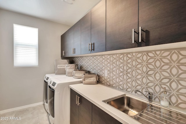 19908 W Montecito Ave, Litchfield Park, AZ 85340 - washroom featuring cabinet space, washer and clothes dryer, and light tile patterned floors
