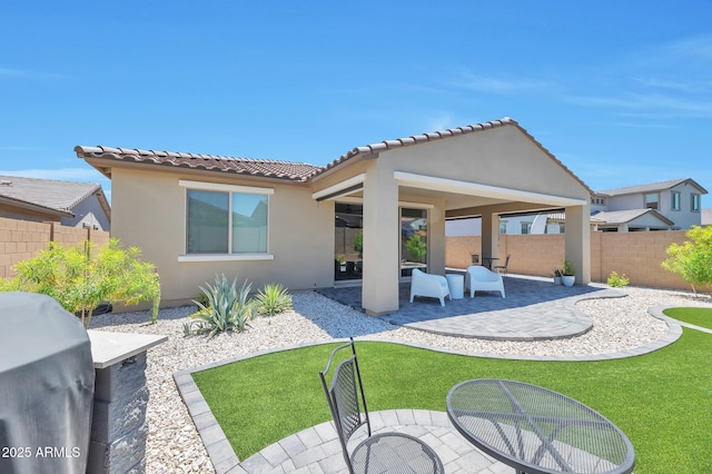 19908 W Montecito Ave, Litchfield Park, AZ 85340 - back of property featuring a patio area, stucco siding, and a tiled roof