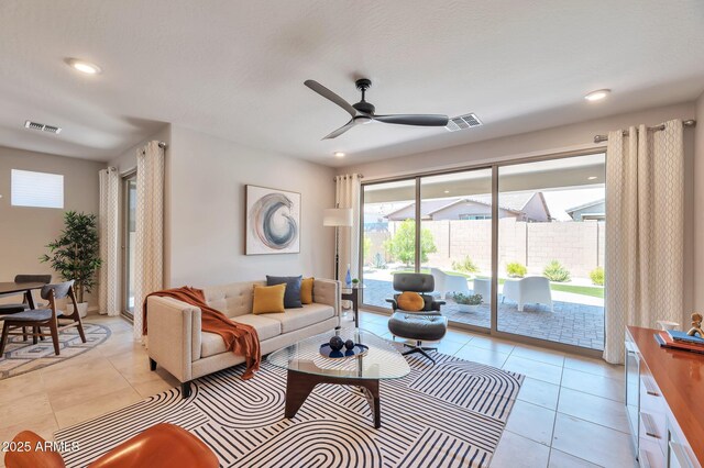 19908 W Montecito Ave, Litchfield Park, AZ 85340 - living area featuring light tile patterned floors, a ceiling fan, and recessed lighting
