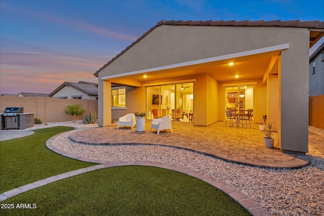 19908 W Montecito Ave, Litchfield Park, AZ 85340 - back of property featuring a patio, stucco siding, and a fenced backyard