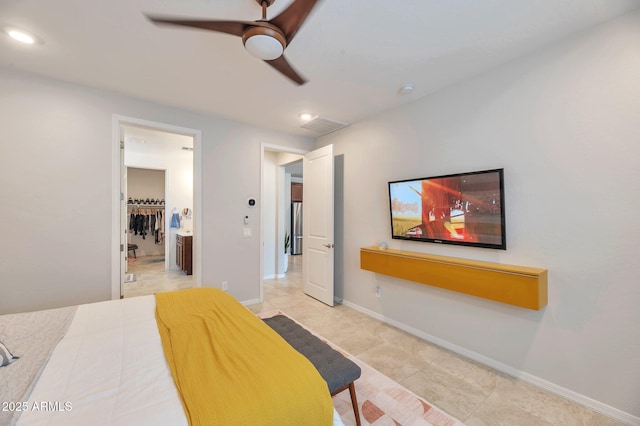 19908 W Montecito Ave, Litchfield Park, AZ 85340 - bedroom featuring recessed lighting, connected bathroom, freestanding refrigerator, light tile patterned flooring, and ceiling fan